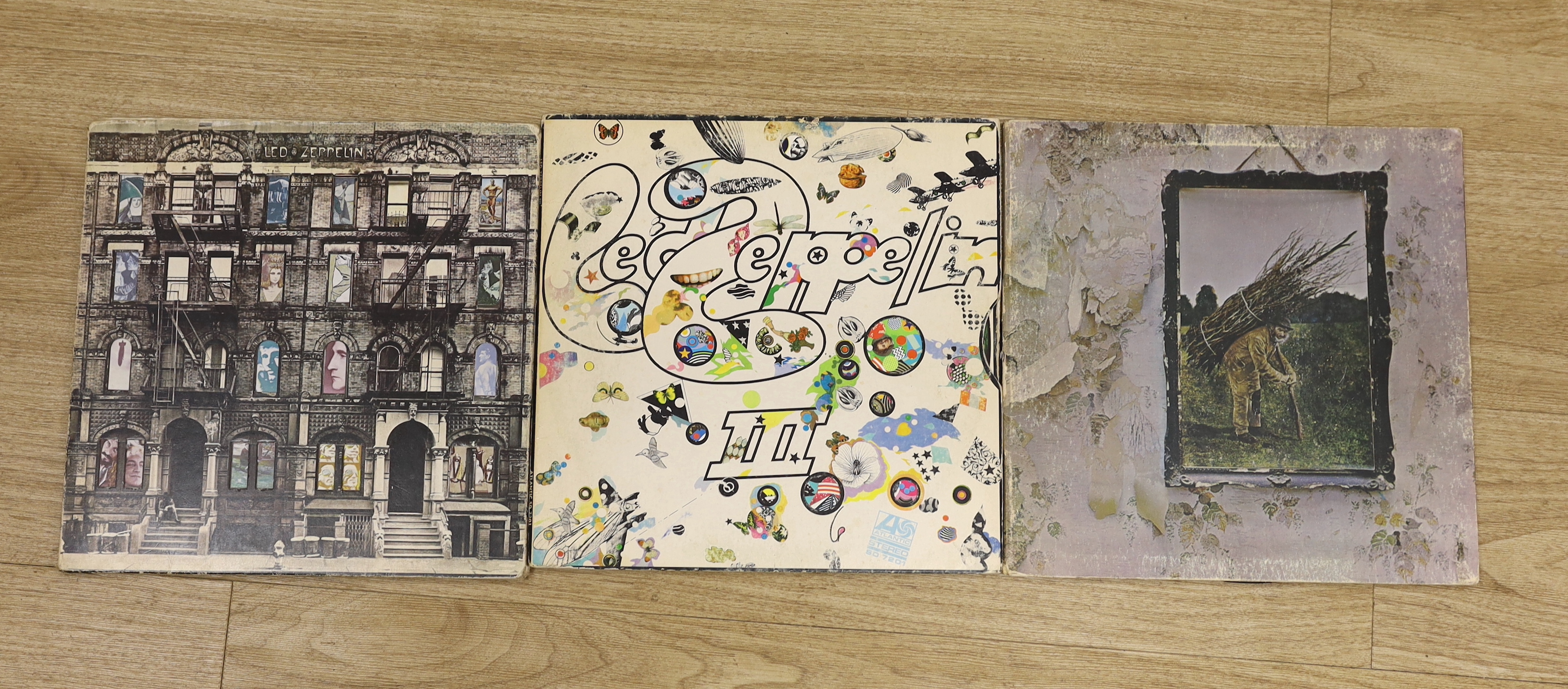 Nine Led Zeppelin LP albums, including; In Through the Out Door, in original brown paper bag, Led Zeppelin, Led Zeppelin II, Led Zeppelin III, Led Zeppelin IV, Presence, Houses of the Holy, The Song Remains the Same, and